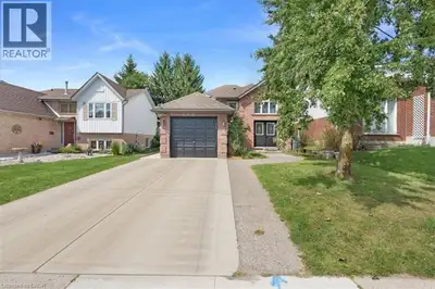 Tucked into Kitchener's Highland West neighborhood, this raised bungalow blends classic charm with e...