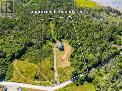 Set on a peaceful 3.2-acre lot down a quiet country road, this unique barn-style home offers both ch...