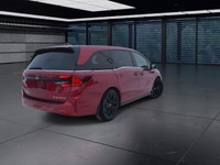 The 2025 Honda Odyssey Black Edition in a striking Red finish, equipped with a Front-Wheel Drive, of... (image 7)