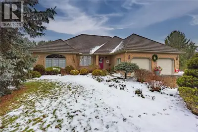 Welcome to 1545 Hwy 3 in Delhi — a custom-built, solid brick ranch that combines elegance, space, an...