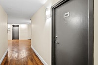Fully renovated spacious suite features kitchen with modern features and finishes including laminate... (image 4)