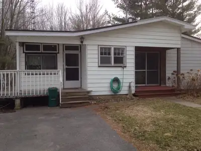 A picturesque country home set back on Battersea road just north of highway 401. This home is locate...