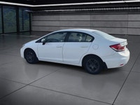 The 2014 Honda Civic Sedan LX, in a pristine white finish and equipped with a smooth front-wheel-dri... (image 5)