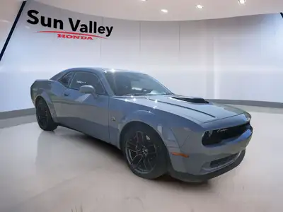 The 2022 Dodge Challenger Scat Pack boasts a roaring 392 Hemi engine paired with a manual transmissi...
