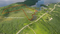 25 forested acre water font lot n Bras D'or lakes. FSBO