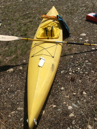Big Yellow 11’ kayak c/w paddle splash cover and floatation bags
