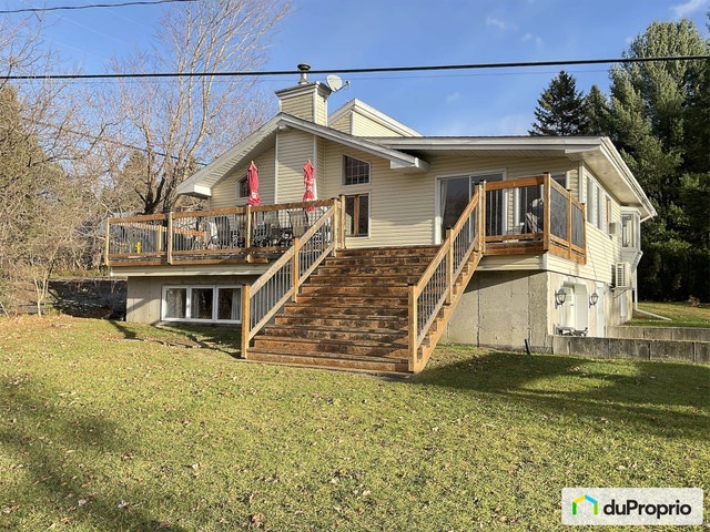 $659,000 - Cottage for sale in Mandeville — photo 1
