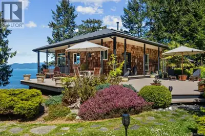 Welcome to a slice of serenity nestled in a remarkable 3+ acre waterfront property. This immaculate...