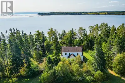 Welcome to 1383 Route 2, Rollo Bay West! This stunning 15+ acre property offers a rare opportunity t...