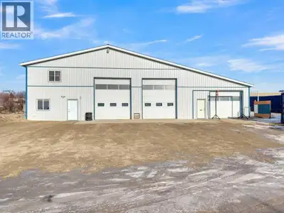 Discover exceptional flexibility and function with this three-bay shop and office property located i...