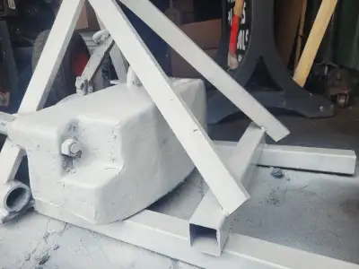 Has heqvy front counter weight mounted on the frame. Very heavy. No offers Will keep for my next tra...