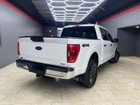 Experience the power and versatility of the 2022 Ford F-150 XLT 4WD SuperCrew, a white powerhouse bu... (image 4)