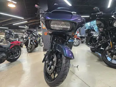 The blacked-out Milwaukee-Eight 114 engine set in the belly of the Road Glide Special takes the cust...