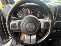A rugged four-door SUV with iconic styling, manual transmission, and strong 4x4 capability, offering... (image 8)