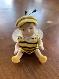 Porcelain baby dressed as a bee