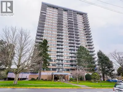 Experience breathtaking panoramic views from this bright, light-filled corner unit in one of Victori...
