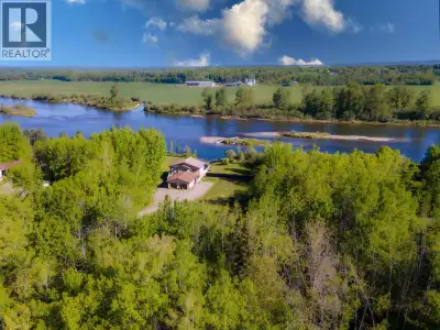 Set on 3.98 acres, this versatile, riverfront, property offers an excellent blend of space, privacy,...