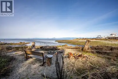 YOUR BEACHFRONT ESCAPE AWAITS! Imagine 0.30 acres of peaceful coastal paradise on a quiet no-through...