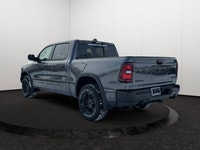 This 2026 RAM 1500 REBEL CREW CAB 4X4 has the following options Lux Leather Trimmed Bucket Seats, Re... (image 3)
