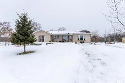 R16//Grunthal/Set on 7 acres of scenic farmland, this beautiful bungalow combines modern comfort wit...