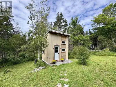 Set on 2.7 surveyed, wooded acres, this private retreat sits just a mile from Chimney Corner on Cape...