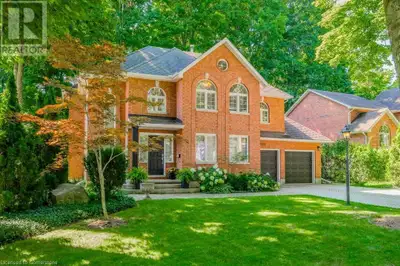 Nestled on a quiet, tree-lined street this custom-built home blends timeless design with everyday co...