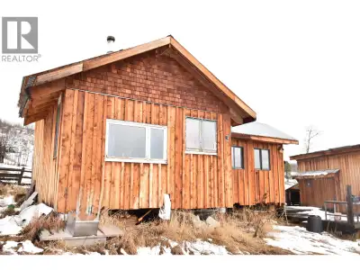 Tucked away on 4.3 acres of rolling countryside, this unique cabin offers a peaceful escape surround...