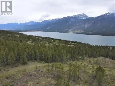 Large acreage with land and Rocky Mountain views- Fairmont Hot Springs, BC. Located only 500m off Hi...
