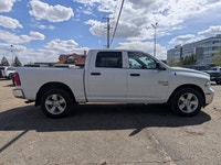 This pre-owned 2023 Ram 1500 Classic SLT Crew Cab is finished in Bright White with a clean Black and... (image 7)