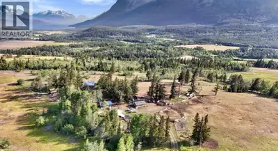 Discover an authentic wilderness retreat on just under 80 acres overlooking breathtaking Tatlayoko L...