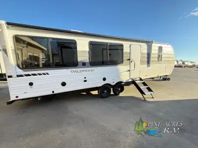 Forest River Wildwood travel trailer 280ZEN highlights: Kitchen Island with Chairs Front Private Bed...