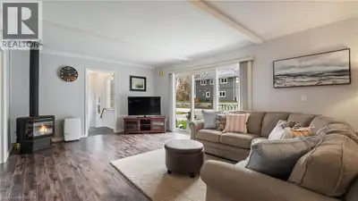A Lifetime of Memories Awaits – Year Round Living Just Steps from the Beach! Step inside this charmi...
