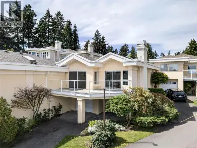 This spacious, beautifully updated ocean view 2 BR + den townhome enjoys a premium location within K...