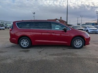 The 2026 Chrysler Grand Caravan SXT in Red Hot Pearl with a Black interior combines style, comfort,... (image 7)