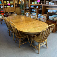 Large oak table with 8 chairs (2 of which are armchairs).