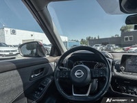 Experience enhanced visibility and an open-air feel in this stunning red 2021 Nissan Rogue SV, featu... (image 8)