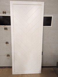 Solid wood sliding door. Brand New. Herringbone pattern.