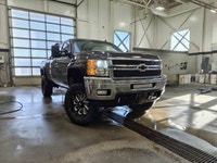 Welcome to Sherwood Buick GMC! Aftermarket 6 Rough Country Lift Kit/Fender Flares/S&B Intake/Headach... (image 1)