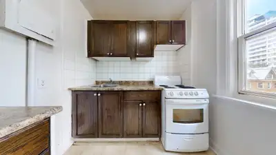 This bright and functional bachelor unit offers open-concept living with large windows that flood th...