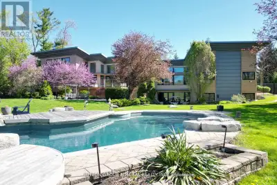 This is a magnificent 2.71 ACRES Frank Lloyd Wright inspired property. Privately set well back from...