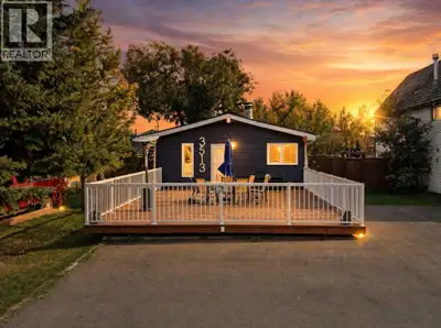 Just one block to the water in Sylvan Lake's Cottage Area, this bungalow has been updated from top t...