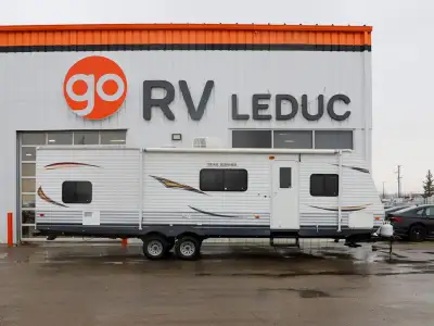 The 2013 Trail Runner 29BHG is a spacious, family-friendly travel trailer designed for comfort and f...