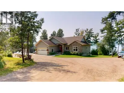 Welcome to Paradise Lane, one of Charlie Lake's most prestigious waterfront communities. Set on 1.33...