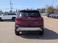 This pre-owned 2023 Nissan Rogue Platinum is finished in a beautiful Red paint with a refined Graphi... (image 4)