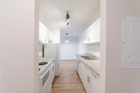 Amenities: Heat & Water Included • Security System • Quiet Buildings Suite & Building: One-bedroom a... (image 5)