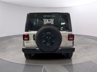 The 2026 Jeep Wrangler Sport 2 Door 4x4, presented in a striking white color, is equipped with a res... (image 3)