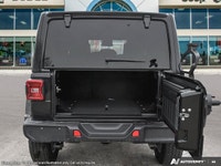 This Jeep Wrangler has a trusty Regular Unleaded V-6 3.6 L/220 engine powering this Automatic transm... (image 6)