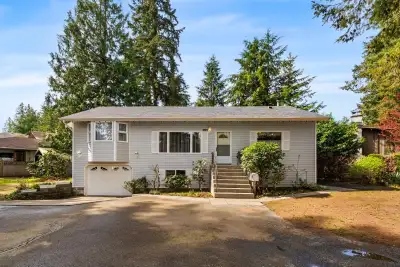 10,500 sq. ft. CORNER LOT in Brookswood. This flat 107' x 77' parcel offers exceptional development...