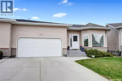 Stunning, elegant bungalow-style condominium backing onto green space, a walking trail, and a pictur...