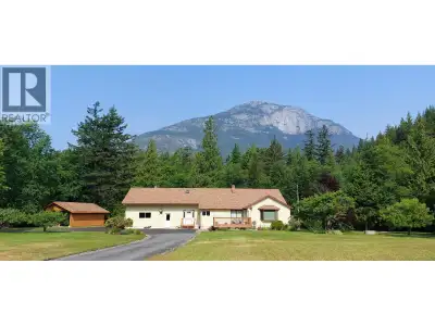 Gracefully situated in the Bella Coola Valley, this 6.5-acre property showcases panoramic mountain v...